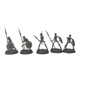 A front-view photograph of five unpainted grey resin skeleton warrior miniatures against a white background. The bare skeletal figures are actively posed wielding long spears and round shields, standing on circular, cobblestone-textured bases.